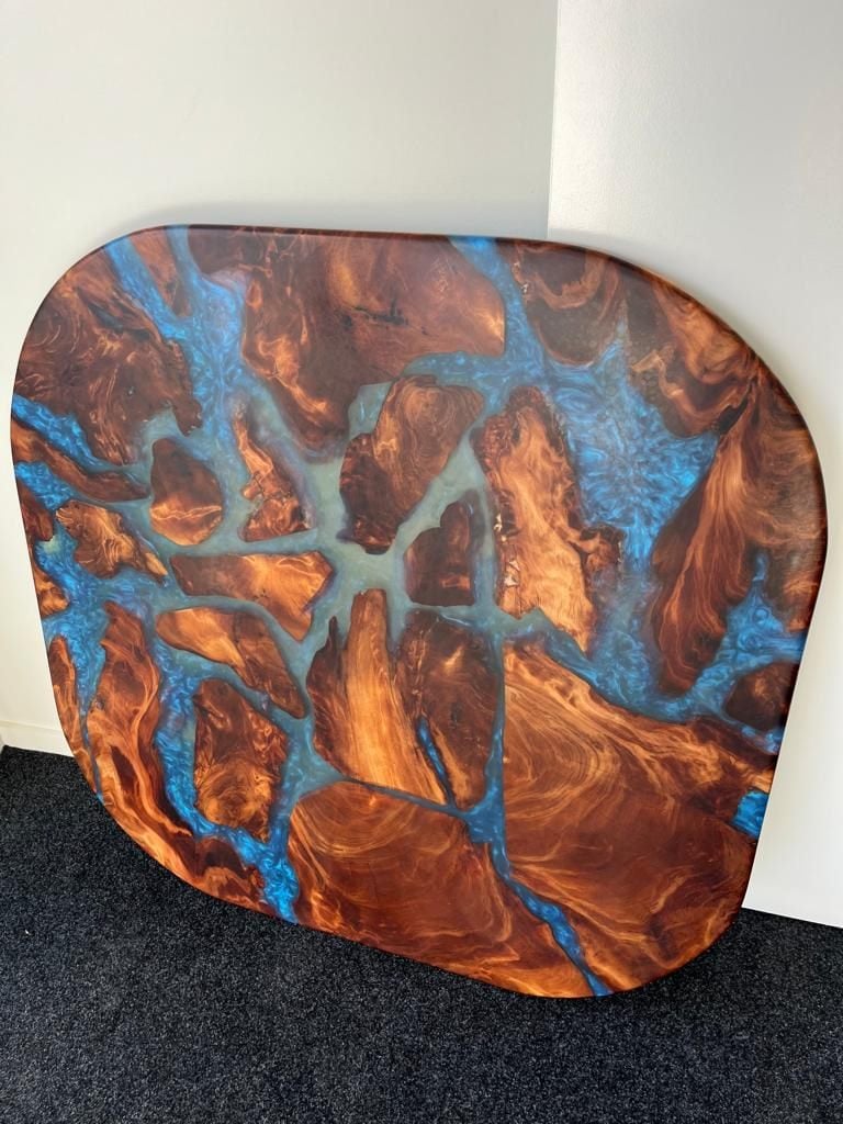 Rounded swamp kauri coffee table top with blue glitter resin