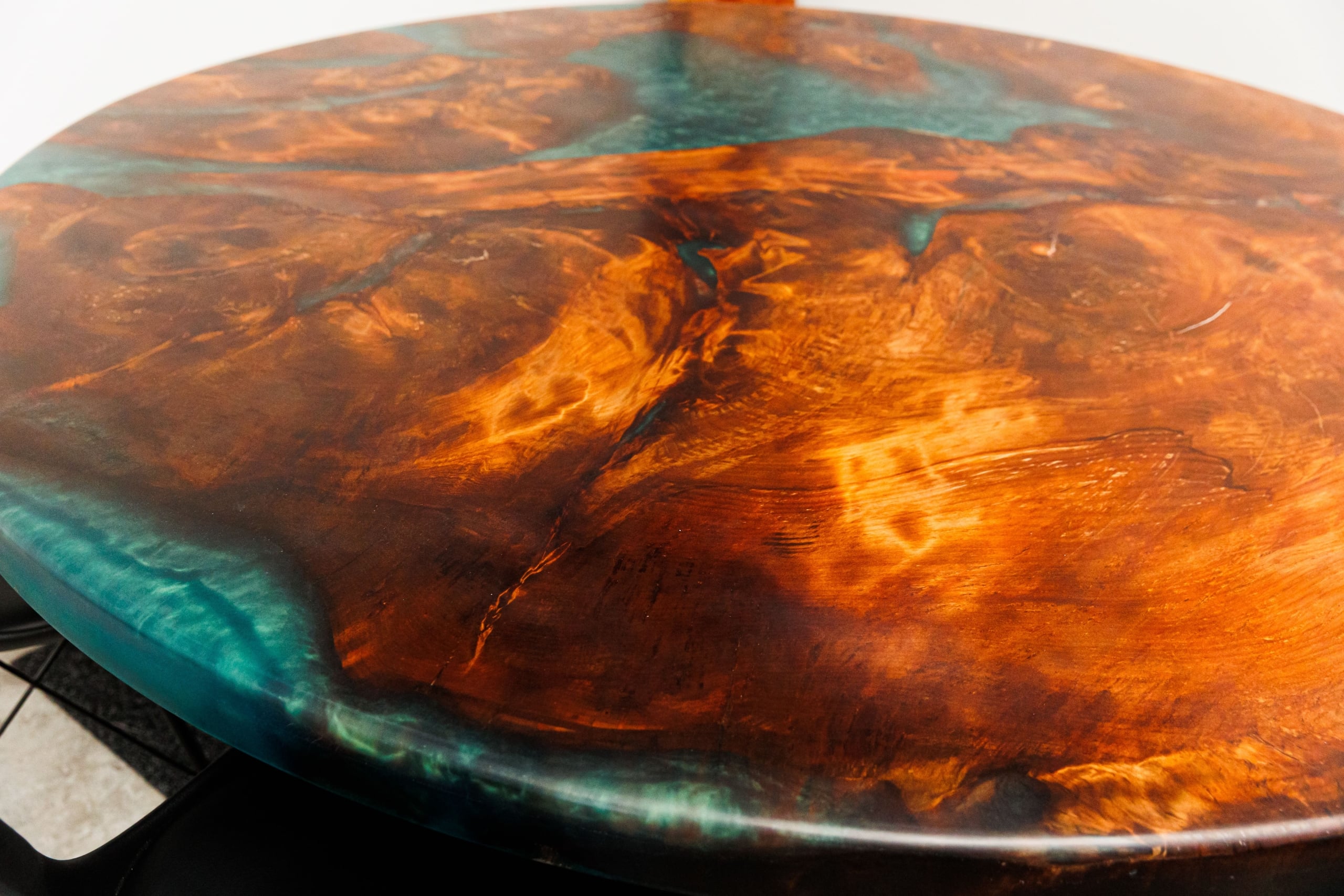 Round swamp kauri table with teal resin edges