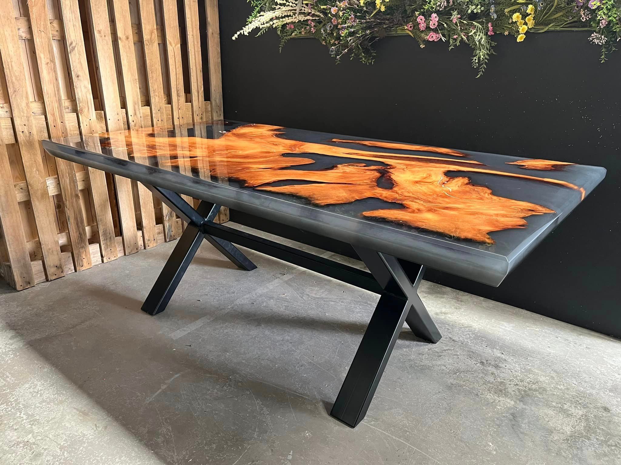 Swamp kauri and grey resin dining table with black X legs